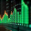 Close-up of a digital screen displaying complex health analytics and optimization graphs, representing data-driven coaching decisions.